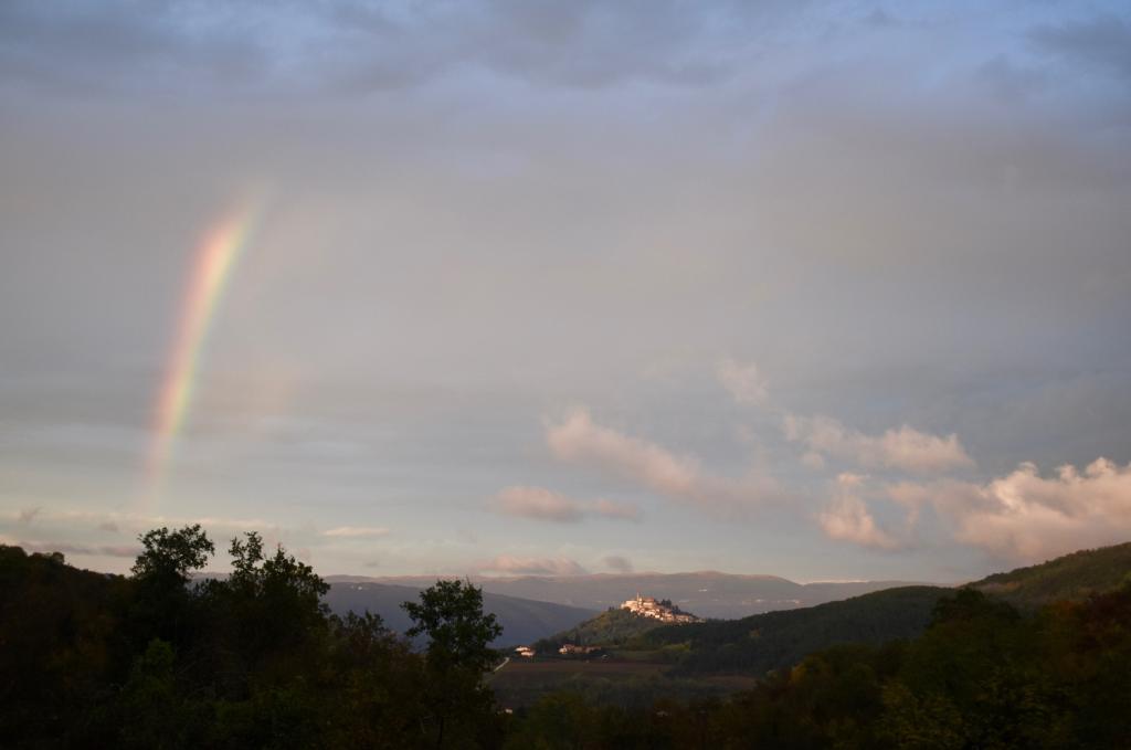 Rainbow and a hilltop town