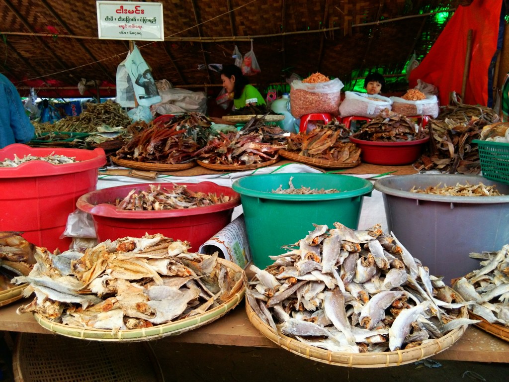 Baskets with dried fish at the market 