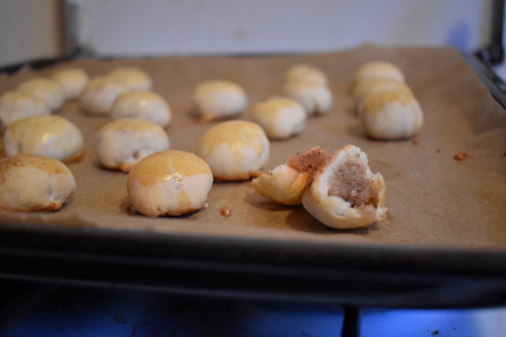 homemade cakes with filling on the baking tray 