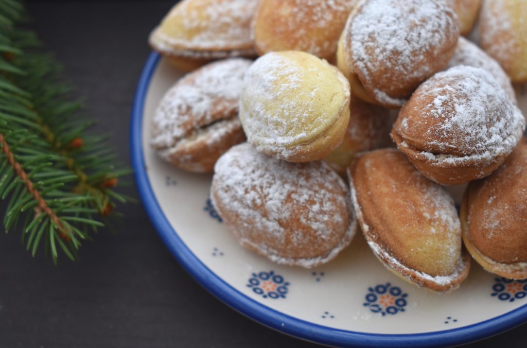 walnut shaped homemade cookies sprinkled with icing sugar